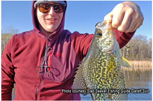 image of angler with big crappie