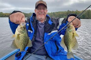 image of ray jensen with big crappies