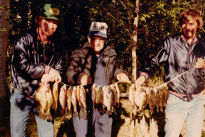 image of men with stringer of panfish